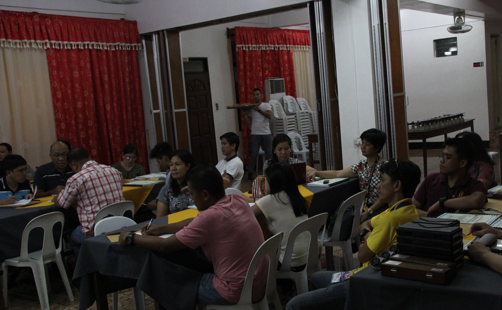 ISAT U faculty and laboratory in-charge listen attentively to lectures. At the lower right corner of the photo are the instruments that will be used in the actual demonstration of calibration practices.