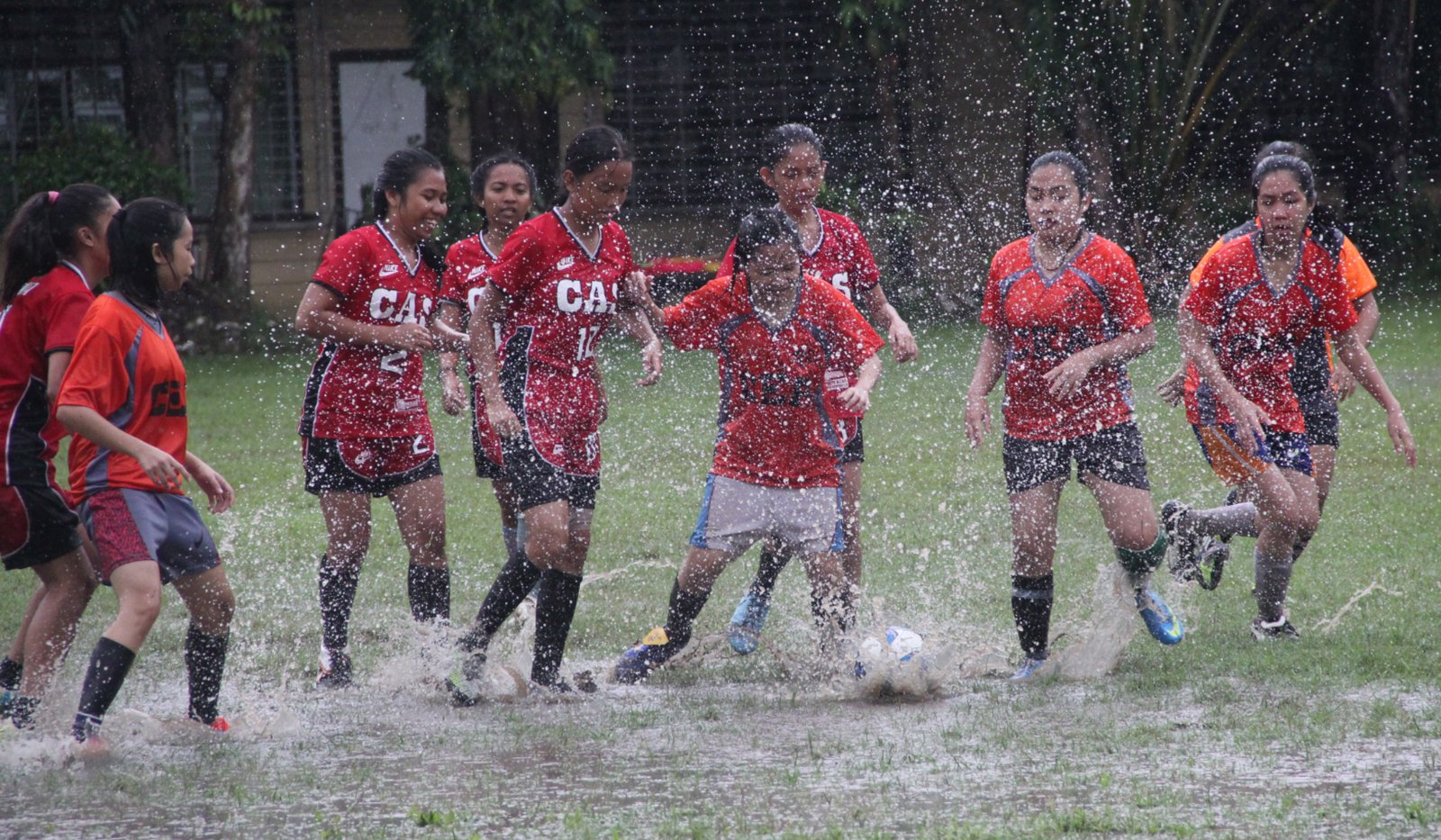 Football in the rain at ISAT U football field.